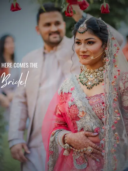 The bride's grand entrance, a moment filled with emotion and anticipation. I focus on capturing the genuine expressions and the beauty of the bridal lehenga and jewelry as she walks towards her new beginning.