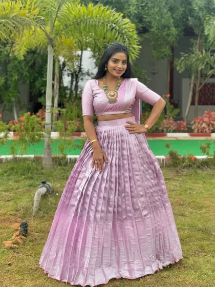 A full-length view of the client in her modern lavender Langa Dhawani, showing its elegant and contemporary appeal.