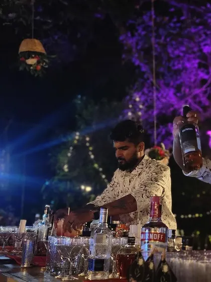 Our team working behind the bar at a lively outdoor night event. We keep the energy high and the drinks flowing, no matter the size of the party.