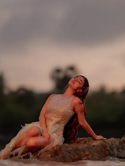 A serene moment from Anushka Sen's music video. The custom sequined dress shimmers beautifully in the twilight, creating an enchanting and memorable image.
