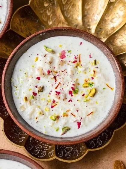 Muttanjan, a traditional celebratory sweet rice dish. It is a rich and aromatic dessert made with rice, sugar, milk, and a variety of nuts and spices.