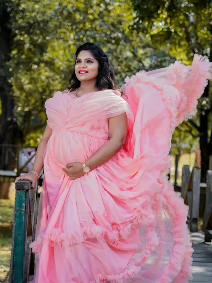 A beautiful example of a soft pink ruffled gown. The layers of tulle add texture and movement, creating a romantic and dreamy look for this solo portrait.