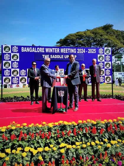 Mr. Dayanand R. Mandre presents The Saddle Up Cup to the winning connections.