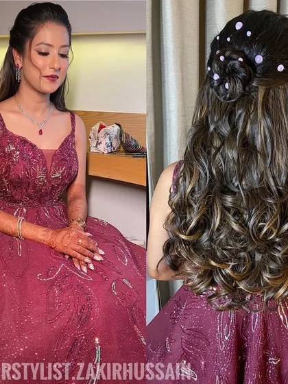 A half-updo with a small bun on top and loose curls, adorned with pearl pins. This is a trendy and stylish choice for a cocktail party.
