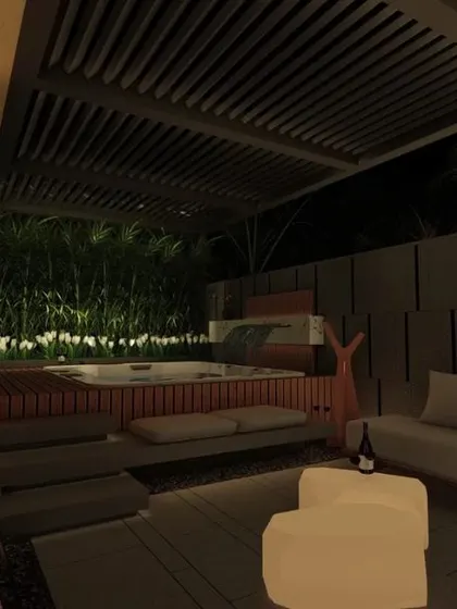 A night view of a private patio for a hotel suite in Ludhiana. The design features a luxurious jacuzzi, comfortable lounge seating under a pergola, and soft, ambient lighting to create a sophisticated and relaxing atmosphere.