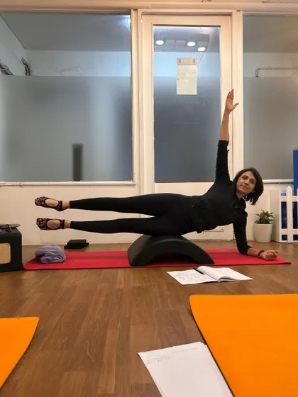 Mastering classic Pilates movements is a key part of the training. Here, I demonstrate a side plank variation on the arc barrel, showcasing the core control and stability we aim to develop.