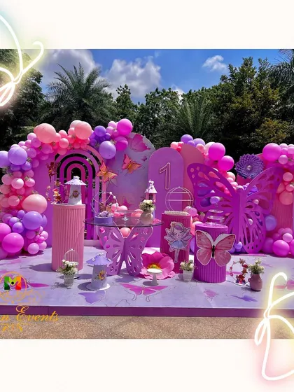 A sunny day calls for a delightful butterfly theme. This first birthday party was a flutter of purples and pinks, with large butterfly wings for a photo booth and delicate details that made the outdoor setting feel like an enchanted garden.