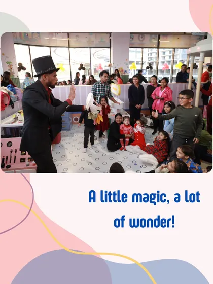 A little magic, a lot of wonder. A magician entertains a captivated audience of children during a birthday party.