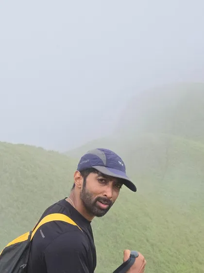 Trekking at Nethravathi peak. The fog and the green hills make for a challenging but beautiful climb.