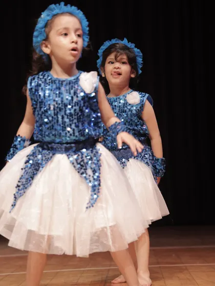 A candid moment between two of our 'Dancing Rockets' performers backstage. The friendships made here last a lifetime.