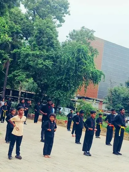 A group of our younger and senior students training together outdoors. We foster an environment where everyone learns from each other, regardless of age or belt level.