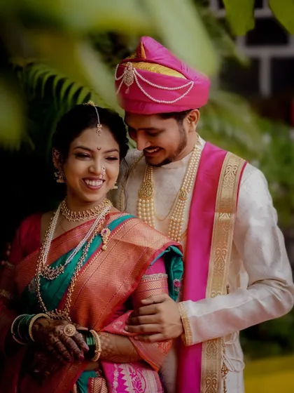 A joyful portrait of the Maharashtrian couple, their smiles radiating happiness and love.