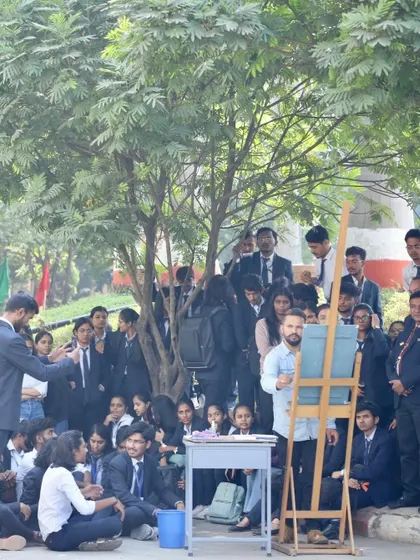 A different angle of the outdoor workshop, showing the students' engagement.