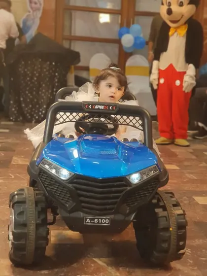 A special car entry for the birthday girl, with Mickey Mouse waiting to greet her. I can arrange these fun entrances to make the day extra memorable.