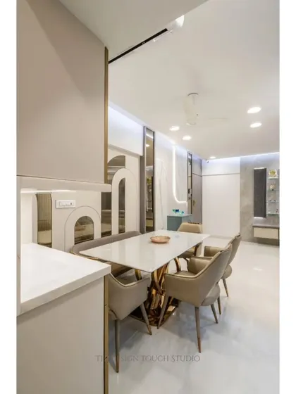 A closer look at the dining table and its connection to the custom cabinetry. This view highlights how we integrate storage and serving areas seamlessly into the dining experience.