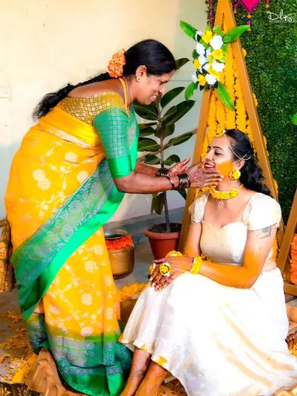 A sweet moment between the bride and a family member during the Haldi ceremony.