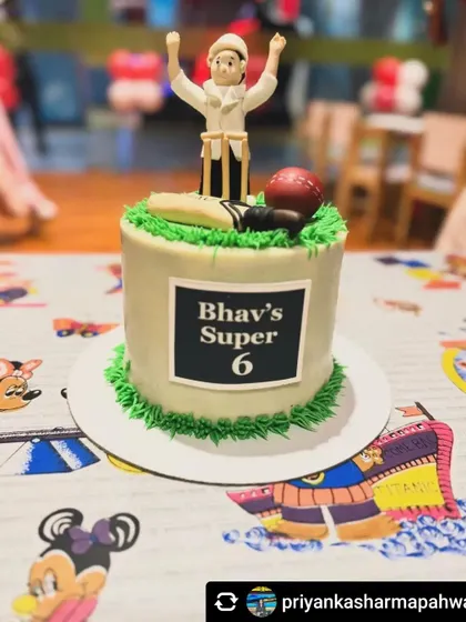 I've been making Bhavamanyu's cakes since his 2nd birthday, and this year he wanted a cricket theme! The cake features an umpire signaling a six, celebrating his "Super 6" birthday.