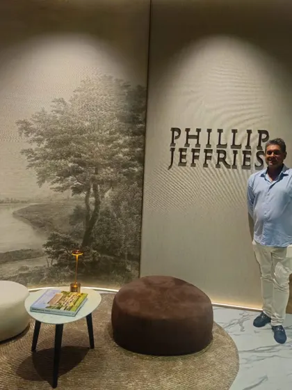 Another view from the exclusive preview at the Phillip Jeffries showroom in Singapore. The backdrop features a stunning scenic mural, highlighting the brand's ability to create large-scale, artistic wallcoverings.