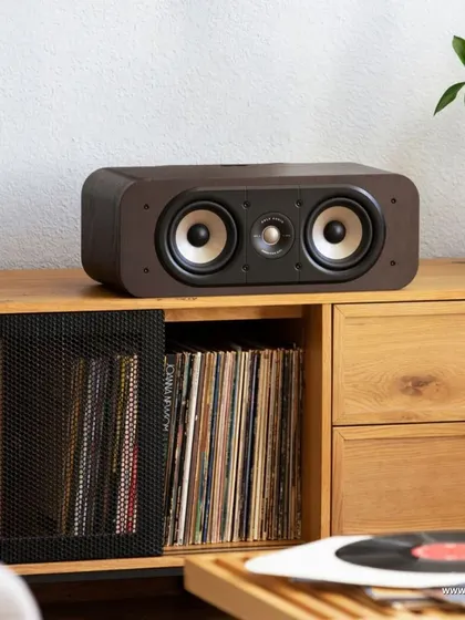 The Polk Signature Elite ES30 center channel speaker, shown here in a dark wood finish, is designed for high resolution audio. It provides crisp, clear dialogue and a robust center image for your movies and shows.