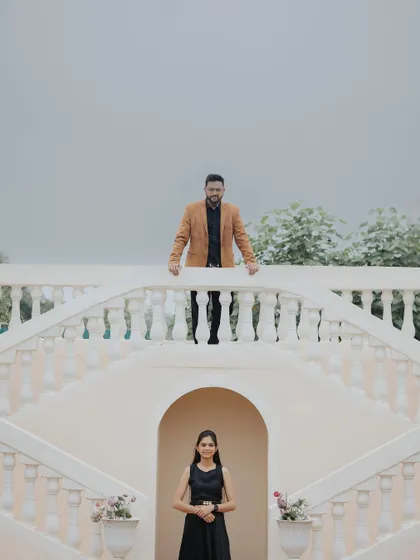 A creative, multi-level composition on a grand staircase set. This type of shot is visually interesting and adds a touch of drama.
