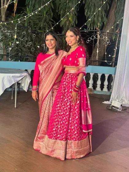 A vision of grace in pink. Here I am with our bride Jothi, both of us in gorgeous pink outfits for a Navratri celebration.