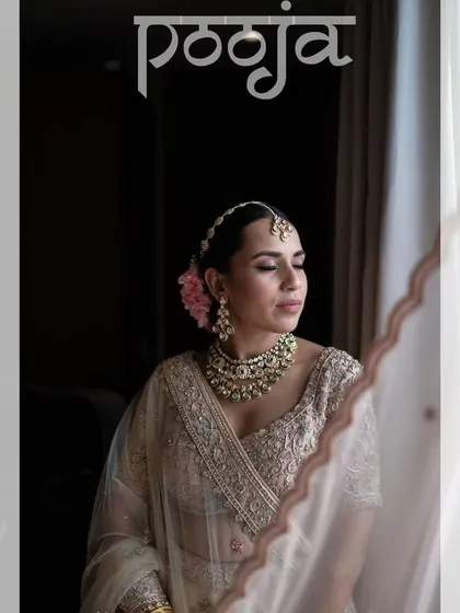A classic bridal portrait, with the bride looking elegant and poised by the window.