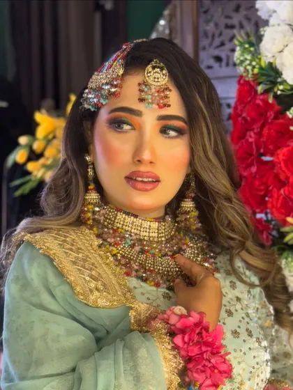 Another beautiful shot of the Haldi look, showing how the colorful makeup and accessories come together to create a stunning and memorable style.