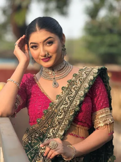 A confident pose from the model. The hairstyle is designed to be chic and modern, suitable for a variety of events from weddings to parties.
