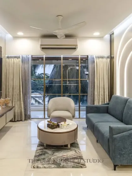 A shot focusing on the living area, with its comfortable seating and large window that brings in natural light. The design is perfect for both relaxing and entertaining.