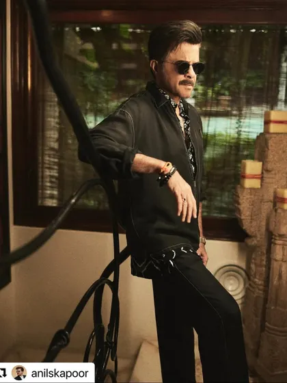 A stylish shot of Anil Kapoor. His hair is perfectly coiffed, showcasing a classic men's hairstyle that never goes out of fashion.