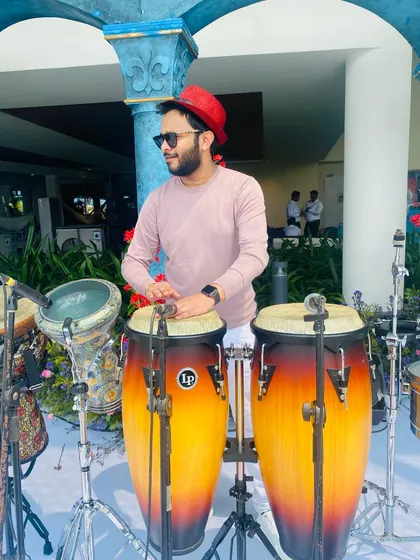A daytime pool party setup in Kochi. I'm on the congas and darbuka, ready to play alongside a DJ to create the perfect sundowner vibe for a wedding event.