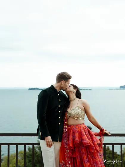 A stolen kiss against the serene waters of Lake Garda, Italy. We framed this shot to highlight both the couple's intimacy and the breathtaking beauty of their luxury wedding destination.