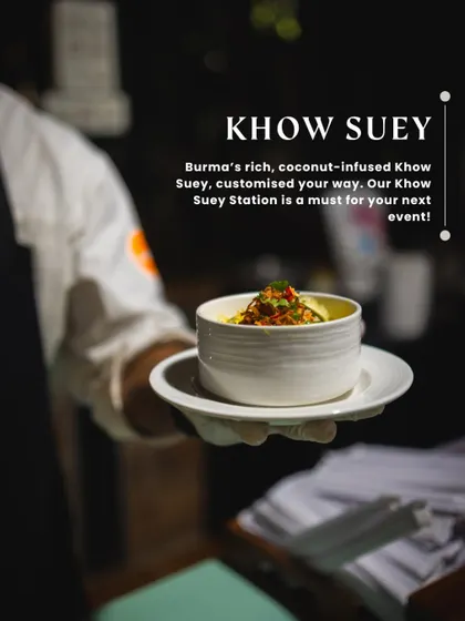 A chef serves a bowl of our signature Khow Suey, a customizable Burmese noodle soup.