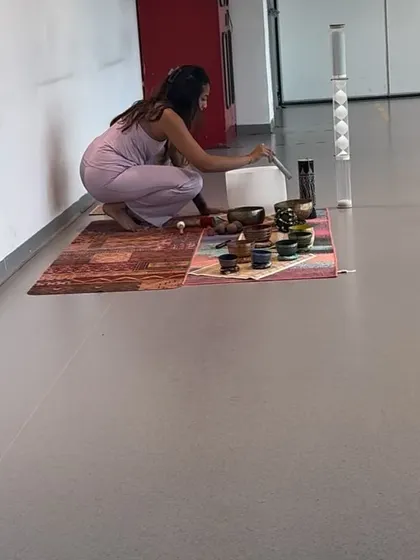 Preparing the instruments for a private sound healing session. The setup is smaller and more intimate, tailored to the specific energy and needs of the individual client.
