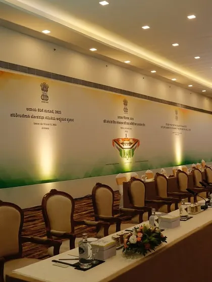 A long shot of the conference seating arrangement, showcasing the clean, extensive backdrop we created. We ensure consistent branding across the entire length of the venue for a polished look.