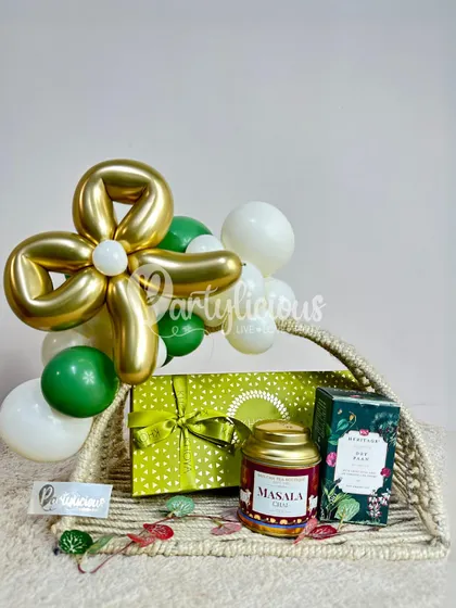 Presentation matters just as much as the gift itself. This basket shows how I can take items you've chosen and style them into a beautifully curated gift hamper, complete with themed balloon accents.