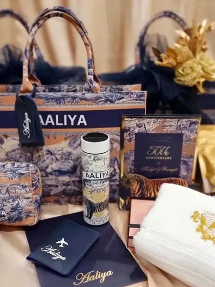 We love putting together the perfect gift, like this stunning anniversary hamper. It features a personalised tote bag, matching pouch, custom tumbler, embroidered towels, and a passport cover, all curated to celebrate a special milestone.