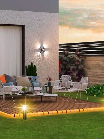 A 3D render of a backyard in Gurugram, with a raised wooden deck for seating and strategic lighting to create a warm ambiance.