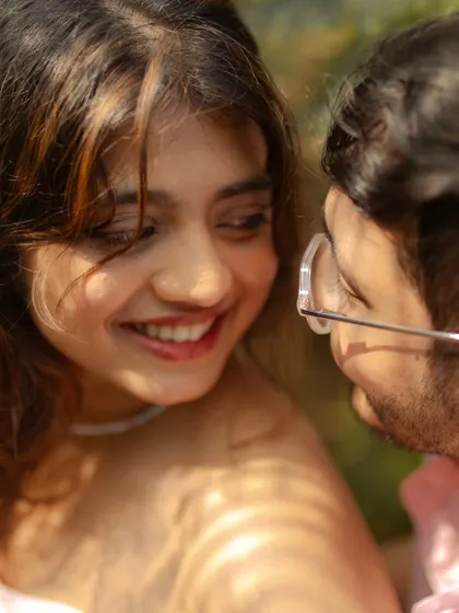 The moment just after a shared joke. This beautiful, genuine smile is the kind of authentic expression we strive to capture in our candid pre-wedding photography.