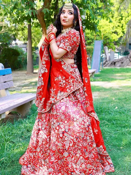 Feel like a princess in our traditional red bridal lehenga. It's the perfect outfit to make your wedding day memorable.