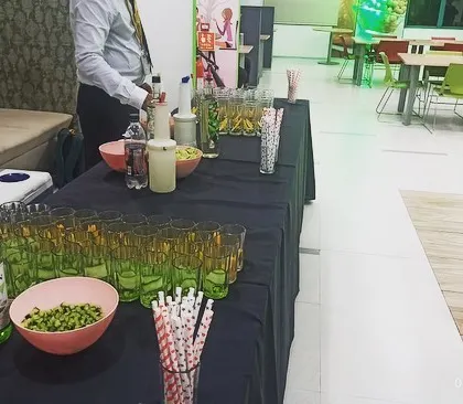 A wide shot of our mocktail station setup in a corporate cafeteria space.