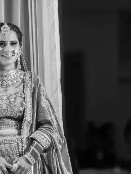 A beautiful black and white portrait of the bride on her wedding day. Her happy, natural smile is the focus of this timeless and elegant photograph.