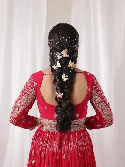 A full back view of the butterfly and pearl braid, showing how the accessories are beautifully scattered to create a starry, magical effect.