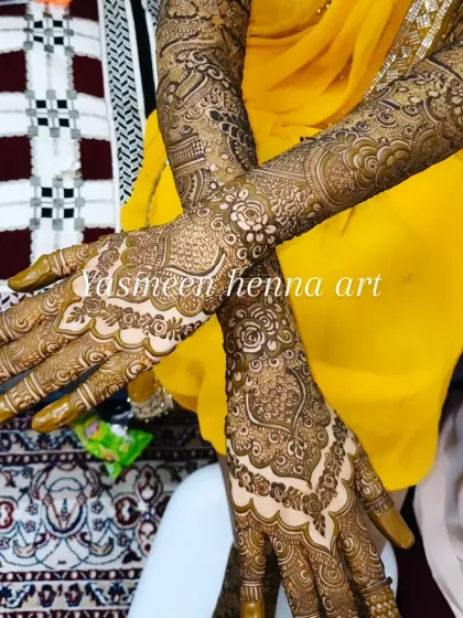 Another view of Faiza's bridal mehndi, with her hands crossed to show how the designs on both hands complement each other.