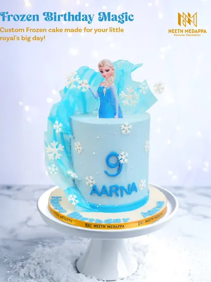 Frozen birthday magic for Aarna's 9th birthday. This cake captures the feel of Arendelle with its icy blue color, snowflake details, and an elegant Elsa topper.