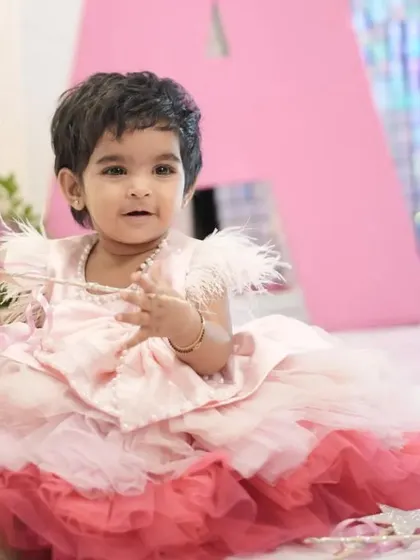 A happy little client at her fairy-themed first birthday party. These precious moments are what we love to help create.