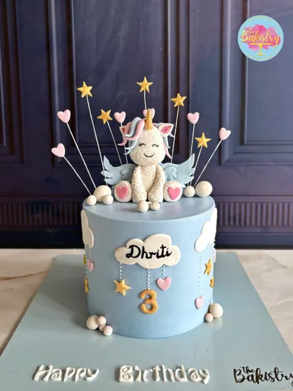 Make your little one’s birthday unforgettable with this enchanting unicorn cake for Dhriti's 3rd birthday, topped with a whimsical fondant unicorn with wings.
