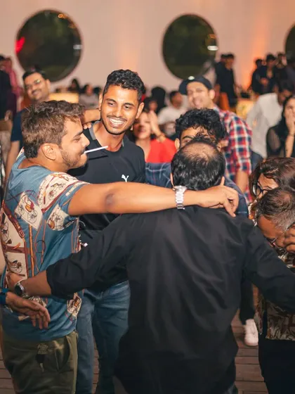 A group hug in the middle of the dance floor. This is what it's all about: good times and great music with friends.