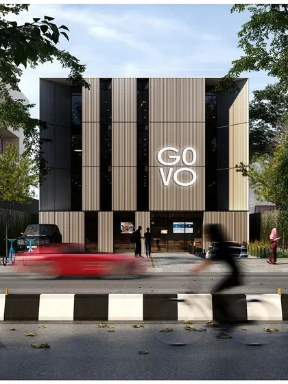 A render of the 'GO VO' office building, conceived as a contemporary monolith. The facade design uses a rhythmic pattern of solid and void to create a clean, graphic identity that is both modern and timeless.