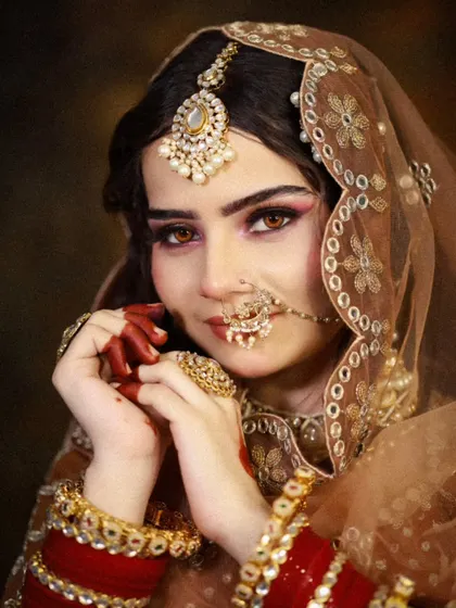 A classic bridal portrait, showcasing the student's ability to create a timeless and beautiful look.